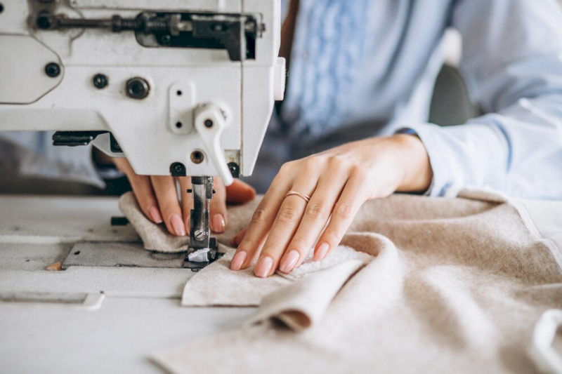 Sewing a custom garment at an industrial sewing machine